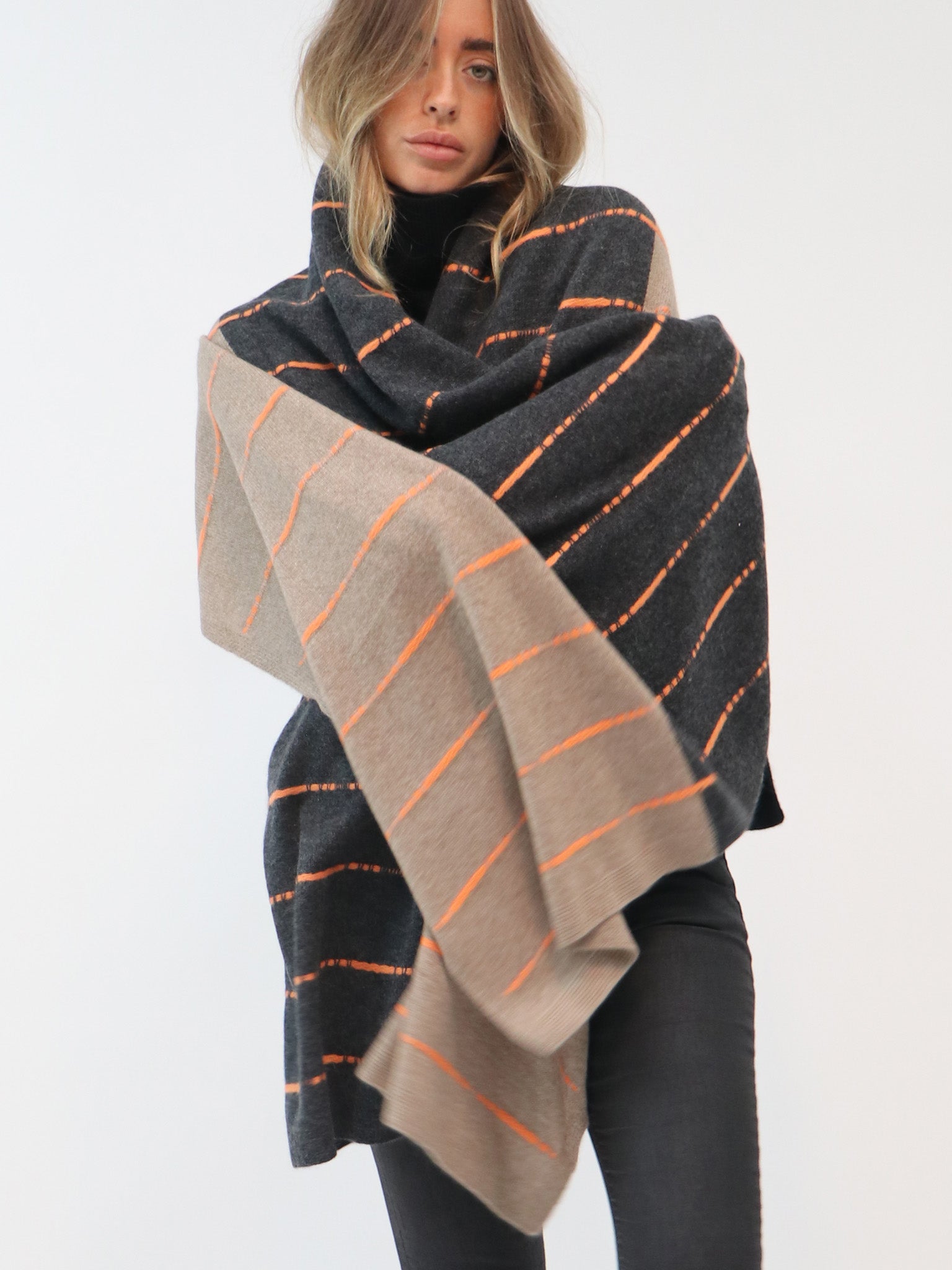 A cashmere scarf and a wool scarf compared side by side