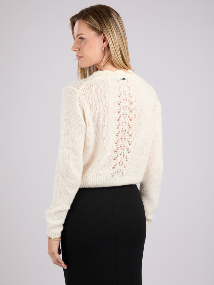 Cashmere long-sleeve knit cardigan with a button-up front and delicate lace-like knit patterns #PEARL
