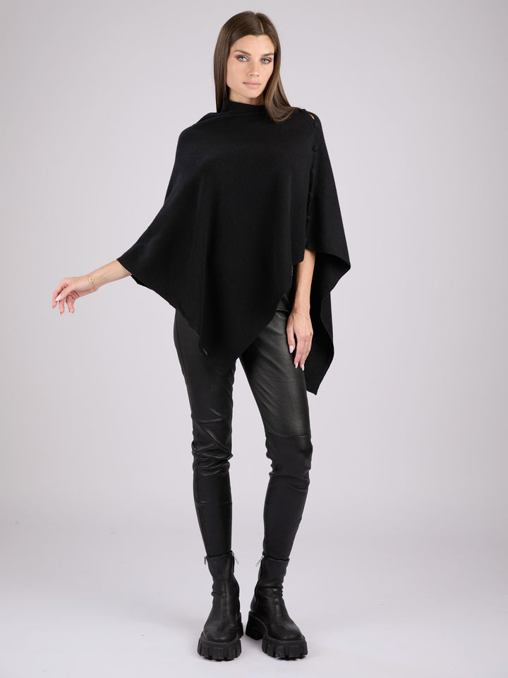 Cashmere knit poncho with  decorative cashmere covered buttons along one edge #BLACK