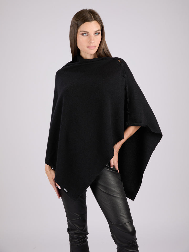 Cashmere knit poncho with  decorative cashmere covered buttons along one edge #BLACK