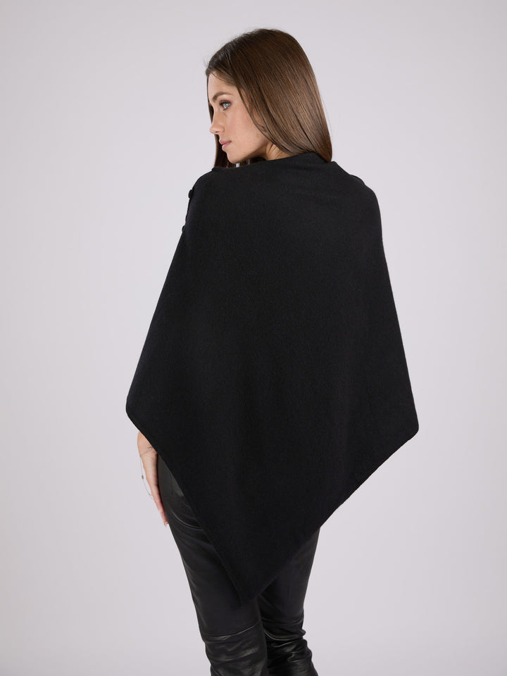 Cashmere knit poncho with  decorative cashmere covered buttons along one edge #BLACK