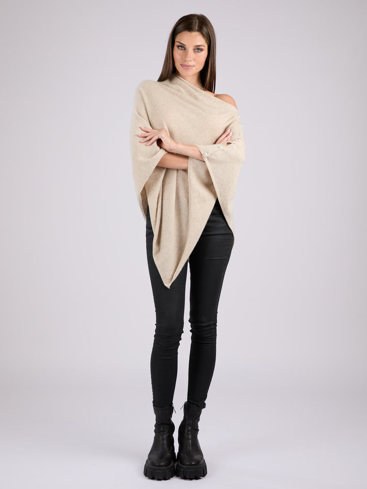 Cashmere knit poncho with  decorative pearl buttons along one edge #LATTE