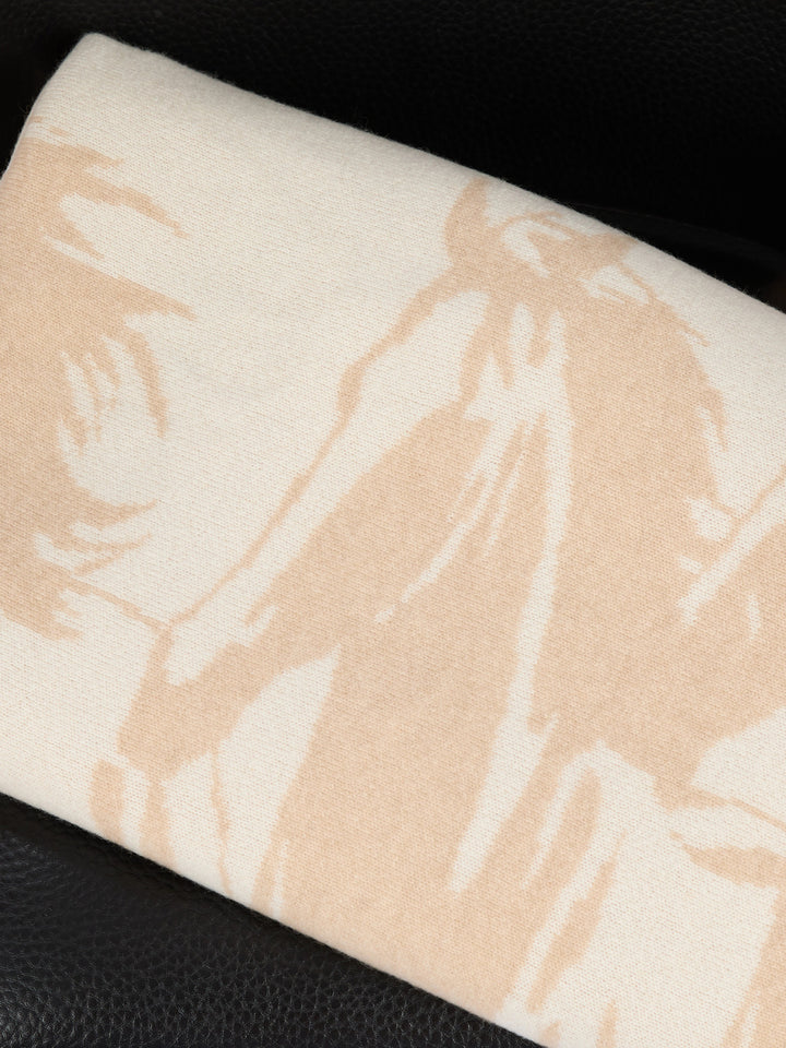 A rectangular cashmere blanket featuring a stylized silhouette of a herd of horses in motion, rendered in a muted oat on a warm pearl background #PEARL/OAT